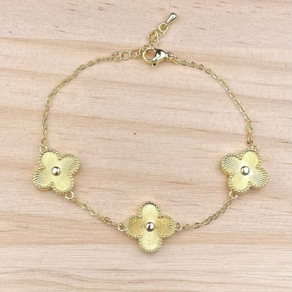 PULSERA DE FLORES DORADA